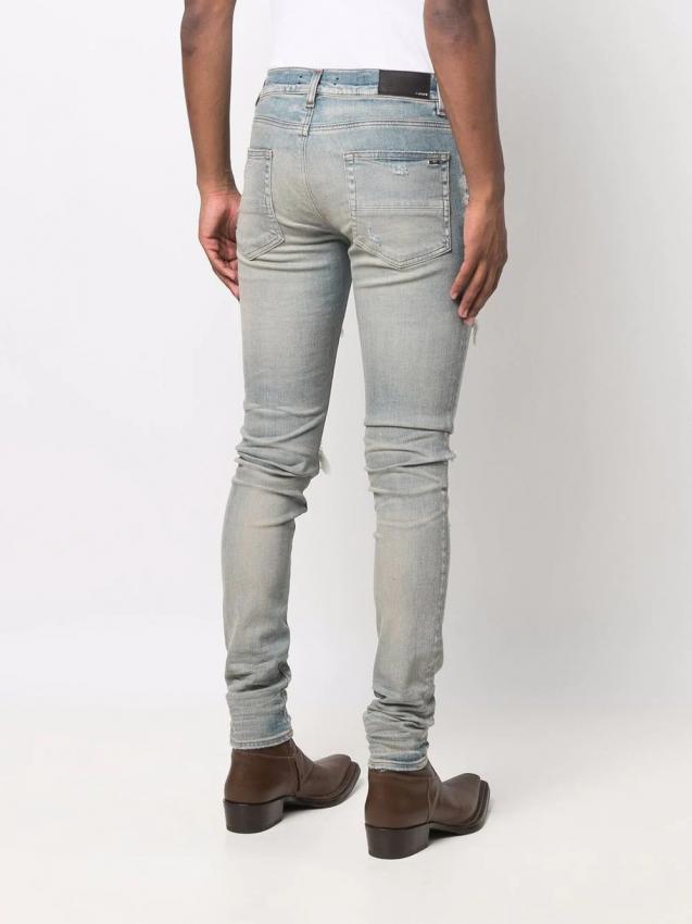 Amiri - distressed skinny jeans