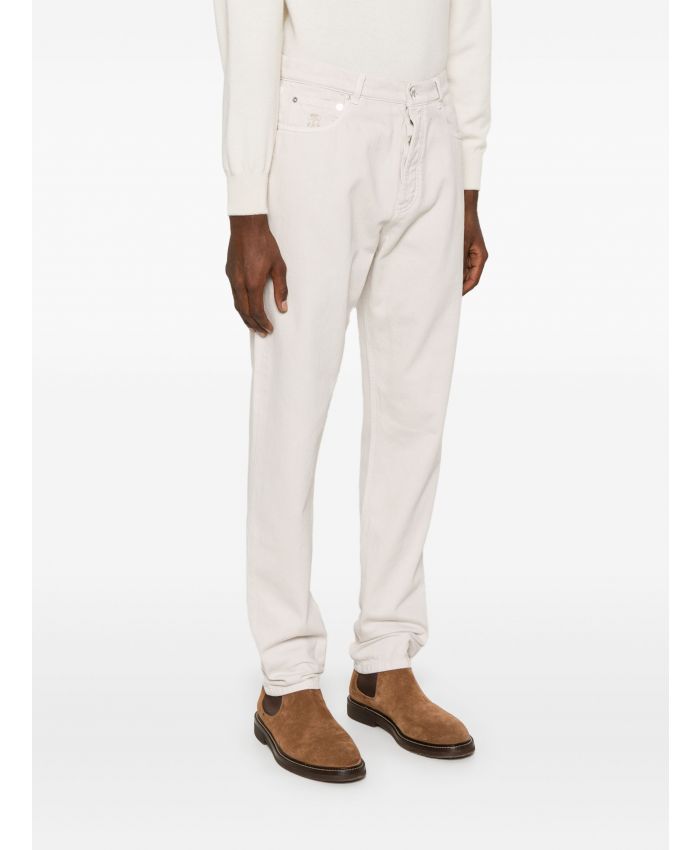 Brunello Cucinelli - logo-embroidered jeans